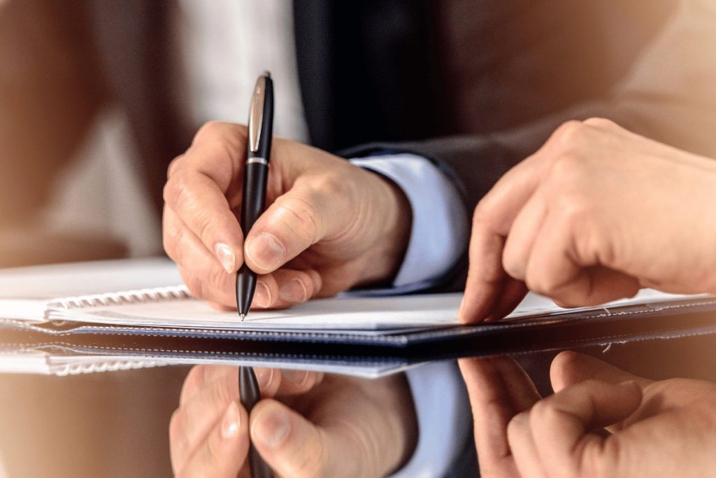 a person sign on a document