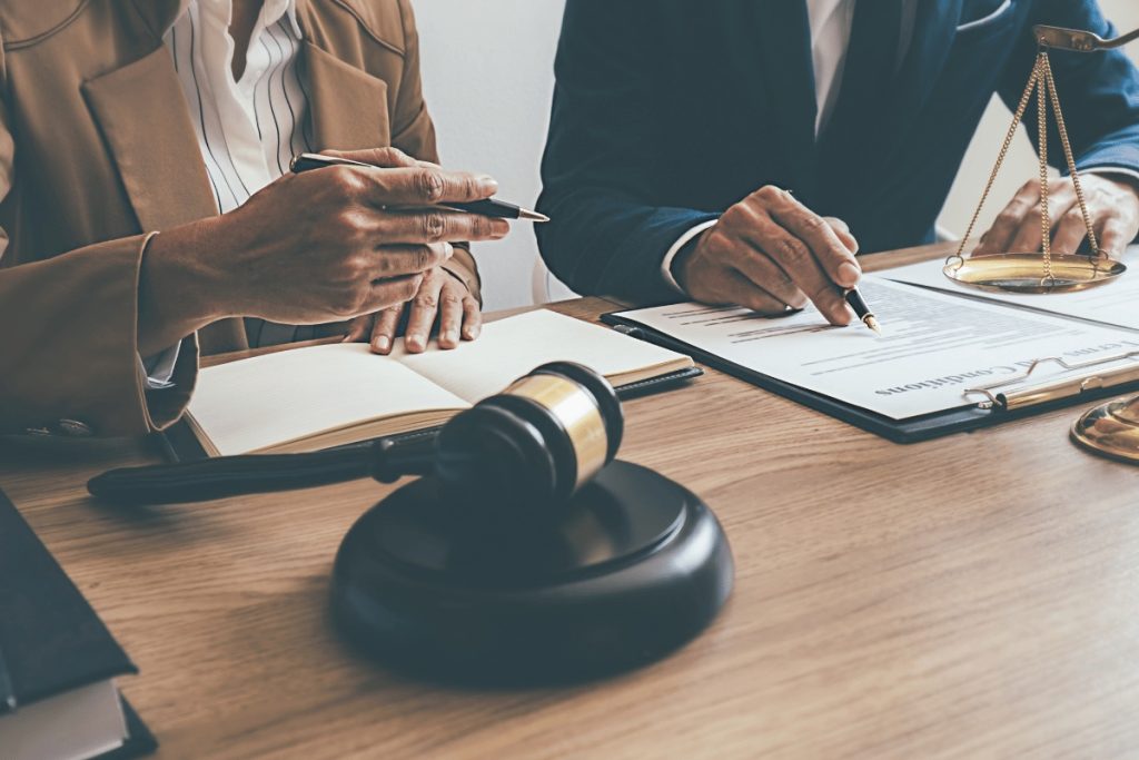 two persons read a document